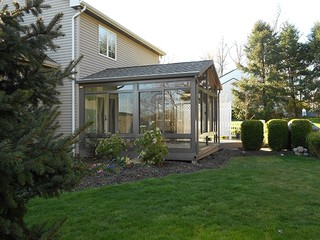brick exterior, covered patio, custom built sunroom